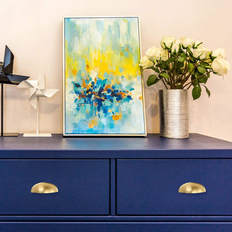 Front view of blue dresser with 5 Pack 3 Inch Center To Center Light Brass Bin Cup Pulls Brushed Gold Zinc Alloy Cabinet And Drawer Pulls.