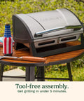 Portable Stainless Steel Gas Grill With Locking Lid For Easy Transport 8000 BTU Propane Grill on a patio table