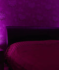 Bedroom with two Plug In Wall Sconce Uplighter With GU10 Spotlight Wash Light on nightstands, purple ambient glow