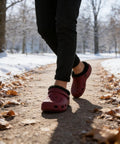 Person walking in outdoor path wearing red clogs with Two Pairs Black Fuzzy Clog Liners Warm Removable Insoles For Indoor Outdoor Wear Size 37 38 Replacement Fur Insert For Cozy Winter Steps With All Day Comfort And Cushioned Support visible.