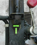 Four Piece T Type RV Level Kit With Bubble Leveler mounted on metal surface, showing precision leveling indicator.