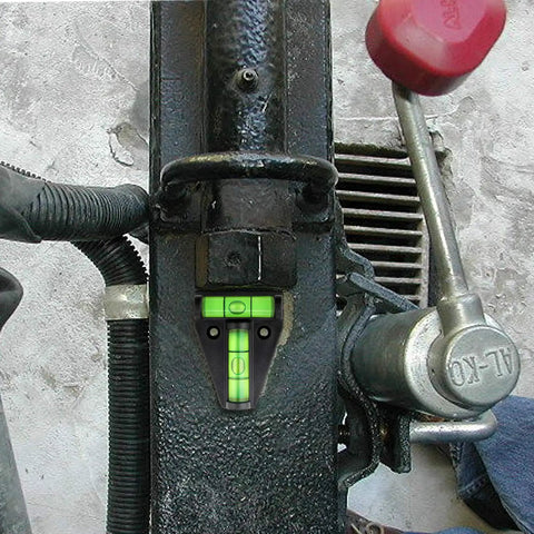 Four Piece T Type RV Level Kit With Bubble Leveler mounted on metal surface, showing precision leveling indicator.
