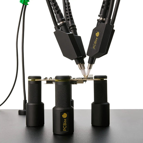 Handsfree Oscilloscope Probe SQ350 350MHz with PCBite holders on electronics workbench for handsfree measurements.