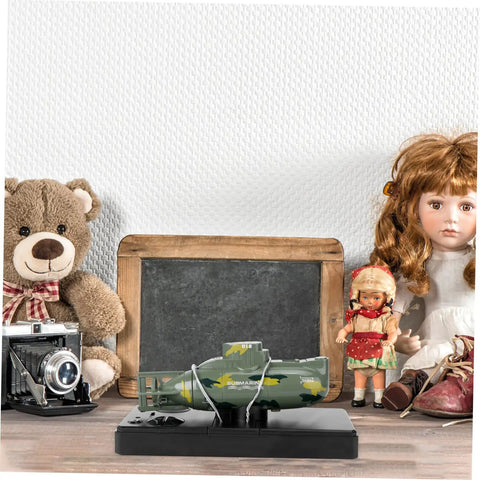 RC Submarine Mini Boat Rechargeable Plastic Dark Green Military Dive Model With 360 Degree Rotation on a wooden table