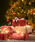 200 Led 72Ft Outdoor Solar String Lights Waterproof With 8 Modes Twinkle Warm White For Patio Tree Christmas Party Wedding Decor No Wiring Needed Perfect For Outdoor Living Spaces Gardens Backyards And Holiday Displays illuminating a Christmas tree with gifts underneath.