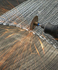Dremel rotary tool with 1.5-inch fiberglass-reinforced cutoff wheel cutting metal mesh, sparks.