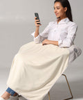 Woman using phone with 5G Blocking EMF Protection Baby Blanket For Pregnancy Belly Shield Organic Cotton Outer Layer large