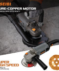 Close-up of a 5-inch concrete angle grinder with 1400W motor featuring diamond cup wheel and safety guard for masonry work.
