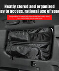 Toyota Land Cruiser Rear Side Window Hanging Bag Organizer for LC250 Prado, black canvas, attached to interior window.