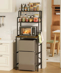 Three Tier Mini Fridge Stand With Heavy Duty Wood And Metal Platforms For Kitchen Dorm Organization Straight Up Rock Solid Base elevating a mini fridge and microwave in a modern kitchen.
