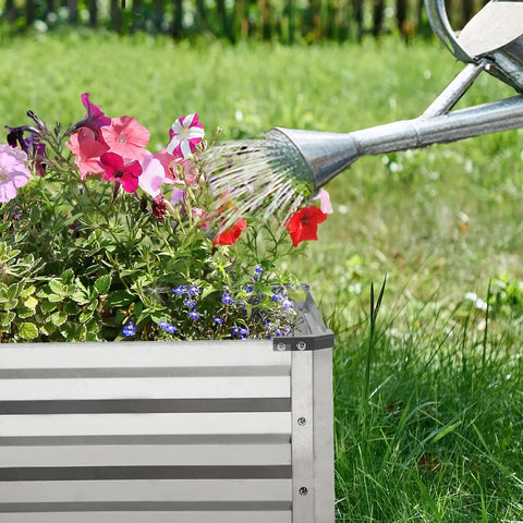 Close-up of galvanized raised garden beds 2 pack metal garden kit 4x8x1 feet each for flowers, being watered