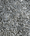 Close-up of 14 oz stainless steel tumbling media mix: balls, cones, and pins
