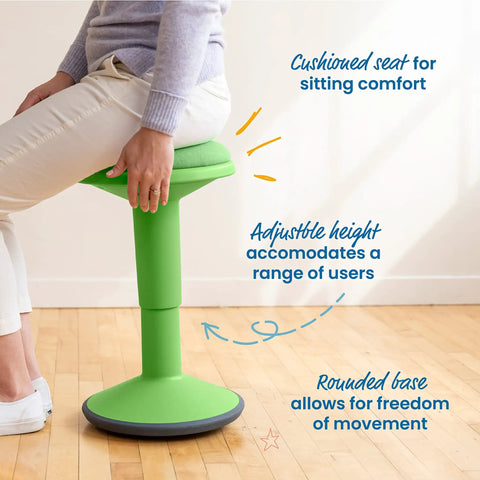Person sitting on Sitwell Wobble Stool With Cushion Adjustable Height Active Seating For Movement Perfect For Class Or Home Grassy Green