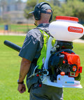 Person using Motorized Fertilizer Spreader Broadcast 4 Gallon Capacity For Lawn Care, Seed Distribution, And Ice Melt Salt