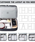 Open waterproof electronics travel organizer bag showing custom layout with compartments for cords, chargers, and devices.