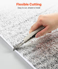 Person using a utility knife to cut Top Shelf Reflective Insulation Roll for versatile radiant barrier applications.