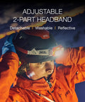 Person wearing Swift RL Rechargeable Headlamp With Reactive Lighting Technology, 900 Lumens, Blue, for outdoor adventures.