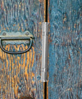 Thickened 4 Inch Stainless Steel Furniture Hinge With Bearing mounted on a rustic wooden door in a home setting