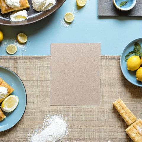 10 Pcs Microwave Waveguide Covers Mica Insulation Sheets 104 by 85 mm surrounded by lemons on a table for DIY kitchen repair