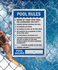Pool Rules Sign 14 By 10 Inch Write On Aluminum With Four Corner Mount Holes Swim At Your Own Risk Shower Before Entering Emergency Assistance Pool Hours 40 Mil Laminated Heavy Duty Weatherproof Outdoor USA Made displayed on a chain link fence by a pool.