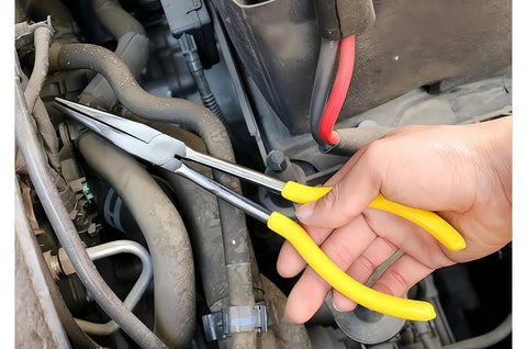 Using a Four Piece Hose Clamp Pliers Set With Case For Auto Repair, Ring Type Adjustable Hose Removal Pliers Up To One Point Six Inches on car engine.