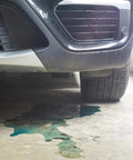 Car with fluid leak on concrete floor, highlighting need for Instant Gas Tank And Radiator Repair Epoxy Putty That Grips Wet Surfaces.
