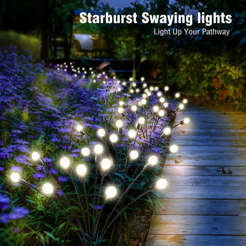 Two Pack 10 LED Solar Firefly Garden Lights Outdoor Waterproof Decorative Lamps illuminating a garden pathway at night.