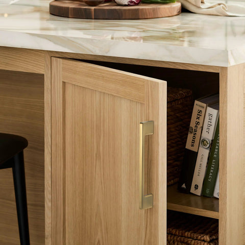 Classic 10 Pack Cabinet Pull Handles for Kitchen and Bedroom Cabinets in Champagne Bronze Finish on wooden cabinet