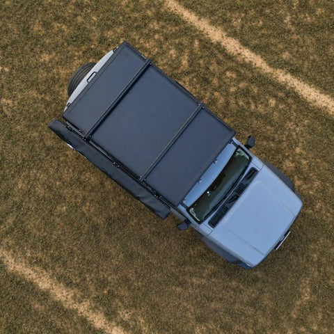 Overhead view of vehicle with Stainless Steel Awning Mounting Brackets For Rooftop Tent Side Tracks, heavy duty side mount kit attached.