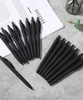 108 Pack Black Retractable Ballpoint Pens No Bleed With 1.0mm Medium Point Smooth German Ink 5.5 Inch Matte Barrel arranged on a desk