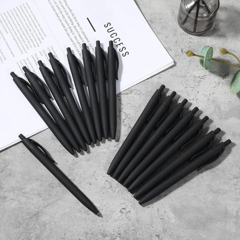 108 Pack Black Retractable Ballpoint Pens No Bleed With 1.0mm Medium Point Smooth German Ink 5.5 Inch Matte Barrel arranged on a desk