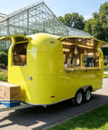 Ready Roll Yellow Food Truck For Pasta And Catering Hustle Packaged With A Full Commercial Kitchen And Private Restroom built different for zero sweat street operations, exterior view in a park setting.