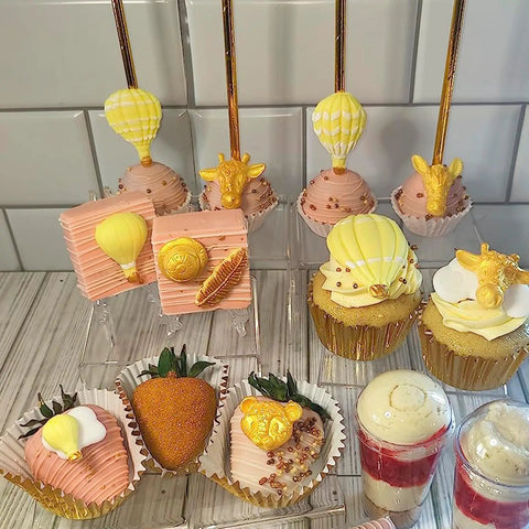 Dessert table with hot air balloon cupcake toppers made using Hot Air Balloon Silicone Molds For Chocolate, Fondant And Cake Decorating.