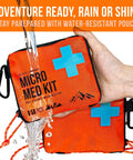 Person holding water-resistant UltraLight Mini First Aid Kit Three Pack For Hiking Camping And Travel Ultralight Water Resistant Medical Kit For Outdoor Adventures Pack Efficient Emergency Kit For Shareable Use.