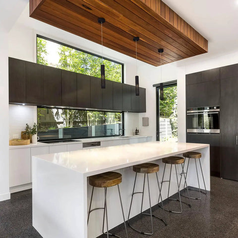 Must-Have Modern Sand Black Cylinder Pendant Light For Kitchen Island And Dining Room, fixtures over white counter.