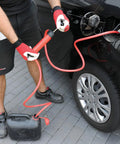 Man using Grab-And-Go 3-In-1 Siphon Fluid Transfer Pump For Gas, Oil And Liquids to fuel car with red hose.