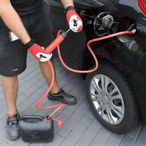 Man using Grab-And-Go 3-In-1 Siphon Fluid Transfer Pump For Gas, Oil And Liquids to fuel car with red hose.