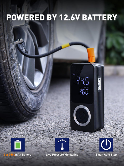 Cordless Tire Inflator With Gauge On The Go Mini Air Compressor next to car tire, powered by built-in 12.6V battery.