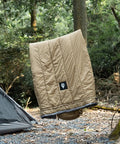 Ultralight Sleeping Quilt For Backpacking And Hammock Camping, 40 Degree Warmth With Footbox hanging between trees next to tent