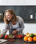Woman cooking in kitchen with 15 Amp GFCI Outlets With LED Indicator And Self Test For Easy No Fuss Install Slim Duplex Receptacles.