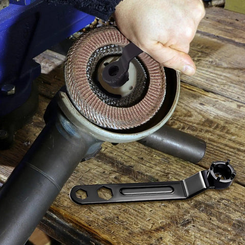 Heavy Duty Angle Grinder Wrench Tool Built Like A Tank With Thickened Four Claws securely gripping a locking nut.