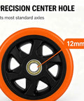 Close-up of precision center hole in six inch caster replacement wheels four pack orange heavy duty polyurethane.