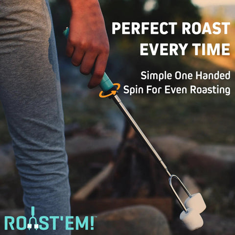 Person using extra long rotating marshmallow roasting stick with retractable handle for campfire cooking