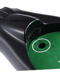 Close-up of the Golf Ball Retriever Auto Return System for Practice showing green putting surface and ball return slot.