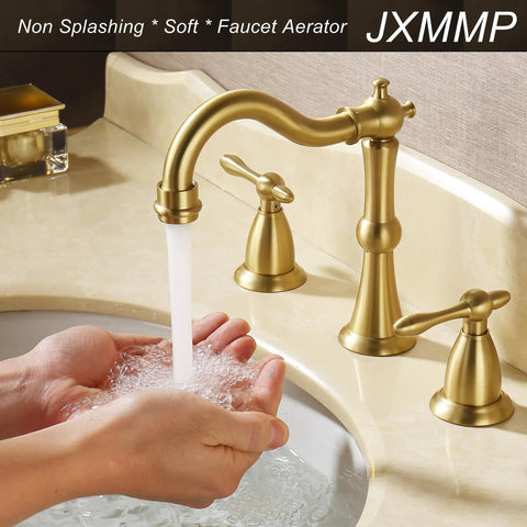 Gold bathroom faucet with water flowing, dual handles, and classic design over sink