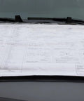 Built Different Tough Blueprint Cover Protector And Plan Sleeve For 36X48 Arch Drawings Posters Maps With Clear Window on a vehicle.