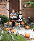 Halloween Skeleton Stakes Pack Of 5 Realistic Skull Arm And Leg Yard Props with kids in costumes on pathway