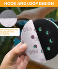 Hand holding foam pad showcasing hook and loop design from 5 Inch Sander Foam Pad Set With 4 Pads And 5 Inch Ceramic Sanding Discs 80 To 1000 Grit 40 Pieces.