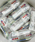 Packs of Concrete Pump Primer That Keeps Pour Sessions Flowing Smoothly in a container, ready for construction use.