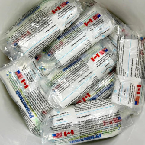 Packs of Concrete Pump Primer That Keeps Pour Sessions Flowing Smoothly in a container, ready for construction use.